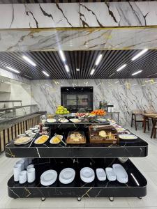 a buffet with many different types of food on display at Veranda XF Hotel in Samarkand