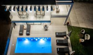 an overhead view of a house with a swimming pool at Villa Dreamscape - Elegant Stay with Private Pool by Villa Mana Gers in Planos
