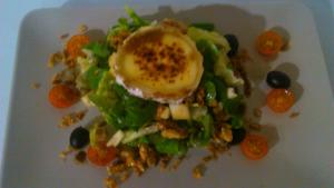 a salad with an egg on a white plate at Casa Maidevera in Aranda de Moncayo