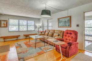 a living room with a couch and a table at Highly Walkable Area! Charming Roswell Bungalow in Roswell