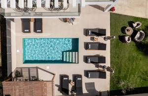 an overhead view of a swimming pool in a house at Villa Dreamscape - Elegant Stay with Private Pool by Villa Mana Gers in Planos +42 photos