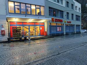 a store on the side of a street at Home and Away in Vaksdal