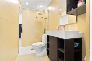 a bathroom with a sink and a toilet at Home and Away in Vaksdal