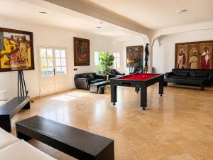 a living room with a ping pong table in it at Hôtel Calipau Riad Maison d'Hôtes in Dakhla