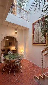 a dining room with a table and chairs at Dar Dada Riad climatisé à votre disposition dans sa totalité et de façon exclusive in Safi +35 photos