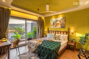 a bedroom with a large bed and a balcony at EKOSTAY - Casa Elara in Igatpuri