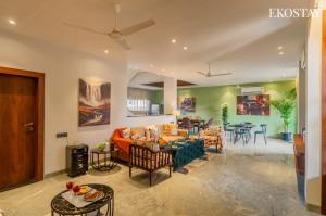 a living room with a couch and a table at EKOSTAY - Casa Elara in Igatpuri