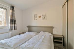 a bedroom with two beds and a window at De Ankergooi! in Hardenberg +20 photos