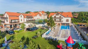 an aerial view of a house with a swimming pool at Hotel Kahlberg in Krynica Morska