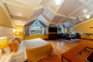 a bedroom with a bed and a living room at Johnson Lodge Manali in Manāli +32 photos