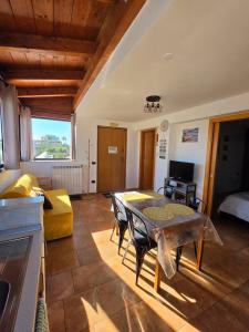 a living room with a table and a couch at Villa Puglia AR 700m from beach -max 4 people- in Bisceglie