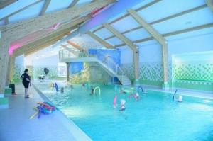 a group of people in a swimming pool at De Ankergooi! in Hardenberg