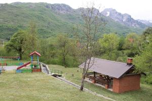 a park with a playground and a building at BB Etno House in Kolašin +88 photos