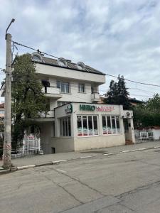 a building on the corner of a street at Niko Hotel in Samokov