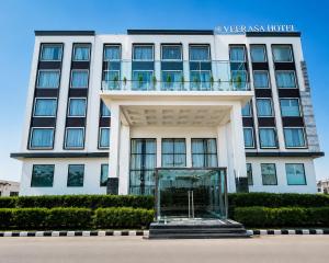 a large building with a glass case in front of it at Veerasa Hotel in Hanumāngarh
