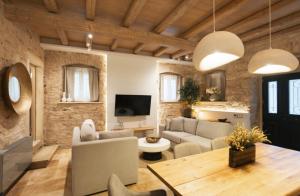 a living room with a couch and a table at Arco Segreto Apartment, Old Town in Corfu