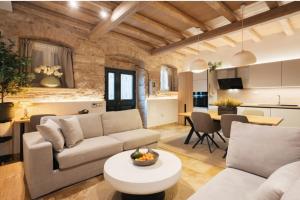 a living room with a couch and a table at Arco Segreto Apartment, Old Town in Corfu