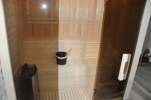 a trash can in the corner of a sauna at Villa Lapis in Mostar