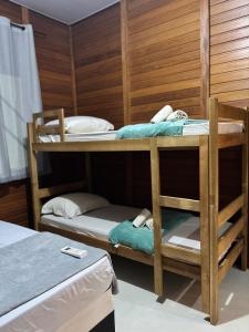 two bunk beds in a room with at HolzHaus em Pomerode in Pomerode