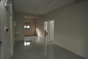 a room with a hallway with a toilet and a sink at Blue Pearl Residency in Trivandrum