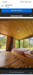 a picture of a bed in a room with a window at Artani selimi in Valbonë