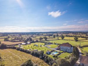 an aerial view of a farm with a house at La Maison Bornat in Versaugues