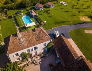 an aerial view of a building with a swimming pool at La Maison Bornat in Versaugues +5 photos