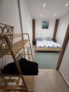 a room with two bunk beds in a room at Hillside Home in Magyarhertelend