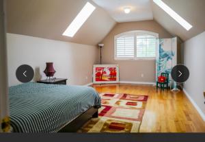 a bedroom with a bed and a window at Forest house 4 bedrooms in Surrey