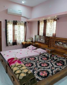 a bedroom with a large bed in a room at Swami's Yatri nivas in Akalkot