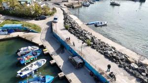 a marina with boats in the water and a dock at Capri Family Hotel in Primorsko +16 photos