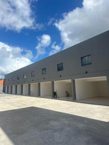 a large white building with windows on the side of it at Villa Marechais in Marechal Deodoro