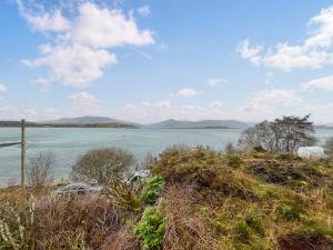 a view of a body of water with mountains in the background at Creag Bheag in Appin