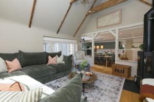 a living room with a couch and a table at The Moorings in St Ives