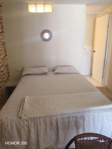 a bed in a room with a large bed sidx sidx sidx at Villa Naylamp loft 10 beach pocitas in Puerto Máncora +29 photos