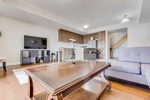 a living room with a couch and a table at Spacious Bright Private! Townhome in Markham in Markham