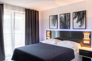 a bedroom with a large bed with two pillows at Beachfront villa with private pool in Vela Luka in Vela Luka +90 photos