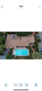 an aerial view of a house with a swimming pool at Villa Iris in Iglesias