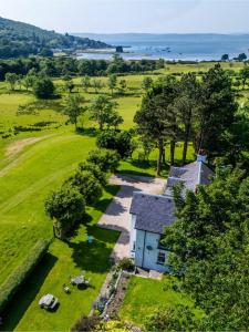 an aerial view of a house in a field at Butt Lodge in Lochranza
