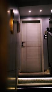a door in a room with stairs in front at Madina Boutique Hotel in Luxor