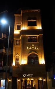 a lit up building with a sign on it at night at Madina Boutique Hotel in Luxor