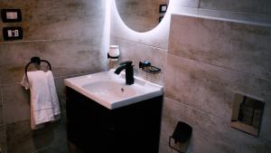a bathroom with a sink and a mirror at Madina Boutique Hotel in Luxor +39 photos