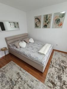 a bedroom with a bed with two pillows on it at Vikend kuća Konjic in Konjic +35 photos