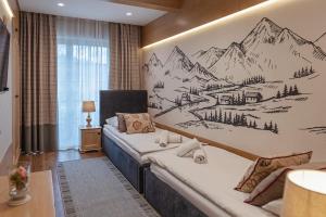 a bedroom with a drawing of a mountain at Rezydencja Sienkiewicza in Zakopane