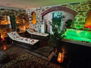 a living room with a swimming pool in a room at Giorgos Suite - Jacuzzi Hideaway in Lydia, Kavala in Lidia