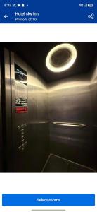 a picture of a bathroom with a microwave at Hotel sky inn in Jalandhar