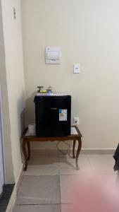a television sitting on a table in a room at Na Ladeira Studio 02 in Rio de Janeiro