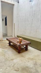 a stuffed dog sitting on a picnic table at Na Ladeira Studio 02 in Rio de Janeiro