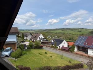 a view of a residential neighbourhood with a solar roof at Zwei schöne Ferienwohnungen in der Nähe von Winterberg in Rengershausen