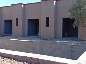 a row of garage doors on a building at immo in Aghmat